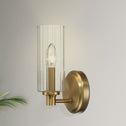 Single Light Wall Sconce with Clear Ribbed Glass, Satin Brass Finish, Elegant Home Lighting Solution, 5" L x 5" W x 10" H, Clear+Gold