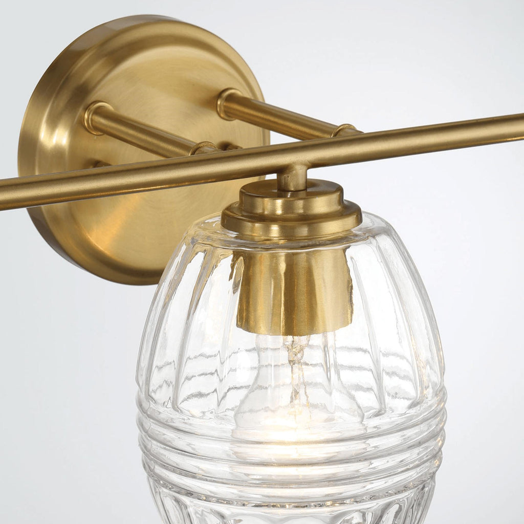 Luxurious Three-Light Vanity Wall Lamp with Clear Glass, Satin Brass Finish, Perfect for Bathroom Decor, 7.5" L x 22" W x 8.5" H, Clear+Gold