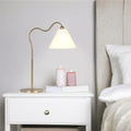 Ornate Brass Ring Base Curved Table Lamp with Triangle White Drum Shade, Modern Design, 18" L x 9.5" W x 22" H, Gold+White