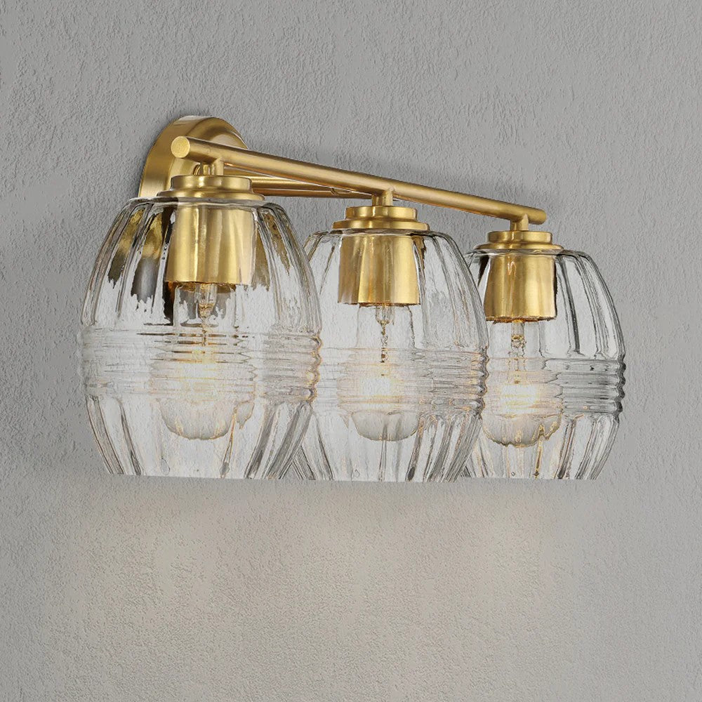 Luxurious Three-Light Vanity Wall Lamp with Clear Glass, Satin Brass Finish, Perfect for Bathroom Decor, 7.5" L x 22" W x 8.5" H, Clear+Gold