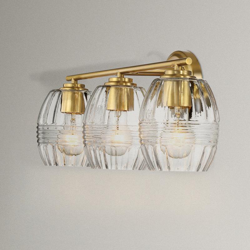 Luxurious Three-Light Vanity Wall Lamp with Clear Glass, Satin Brass Finish, Perfect for Bathroom Decor, 7.5" L x 22" W x 8.5" H, Clear+Gold